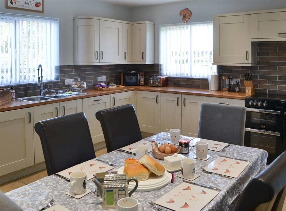 Dining and kitchen areas at Red Hen Cottage in Acklington, Northumberland