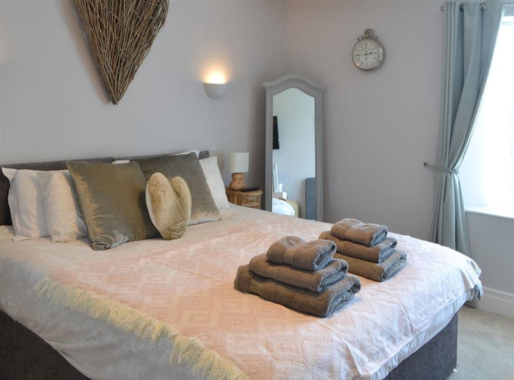 Romantic double bedroom at Red Hen Cottage in Acklington, Northumberland