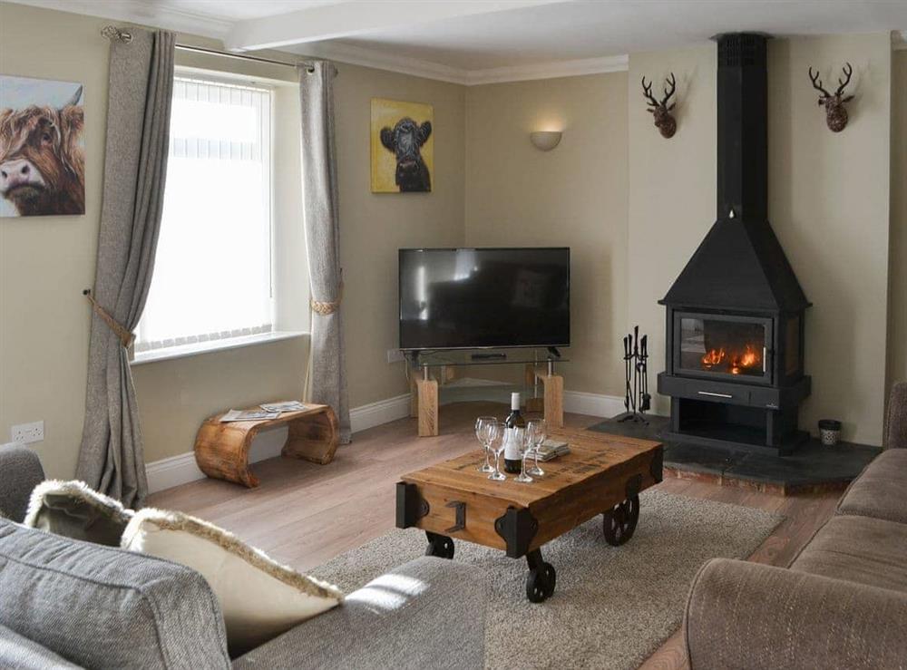 Warm and welcoming living room at Red Hen Cottage in Acklington, Northumberland