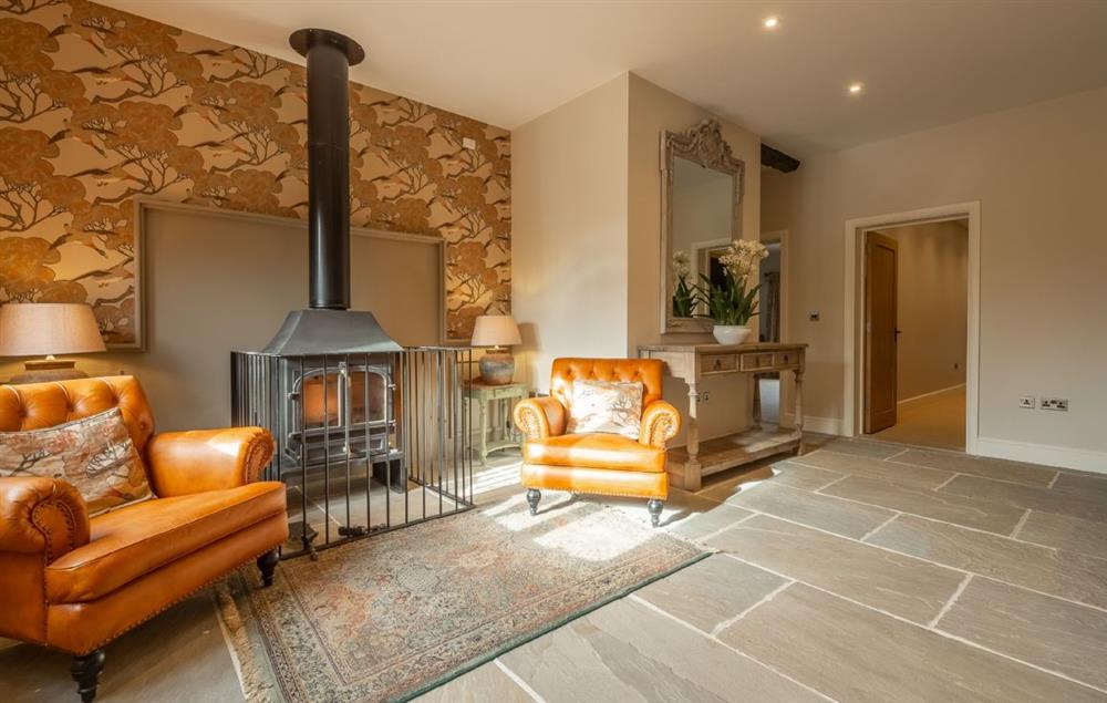 The spacious sitting room in the large living area with wood burning stove (photo 5) at Red Stag Lodge, Little Massingham