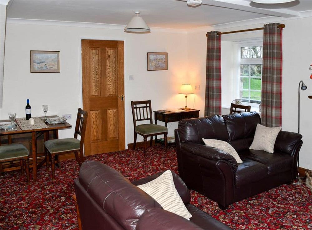 Spacious living and dining room with drop-leaf dining table at Red Syke in Troutbeck, near Keswick, Cumbria