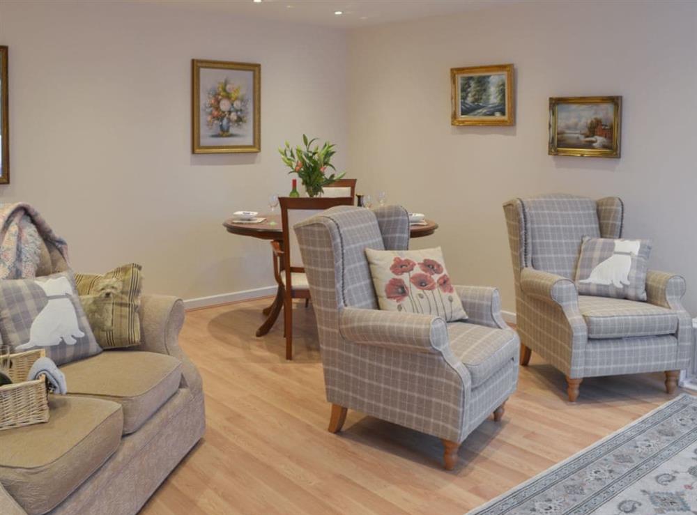 Living room with dining area at Redhouse in Chelston, near Torquay, Devon