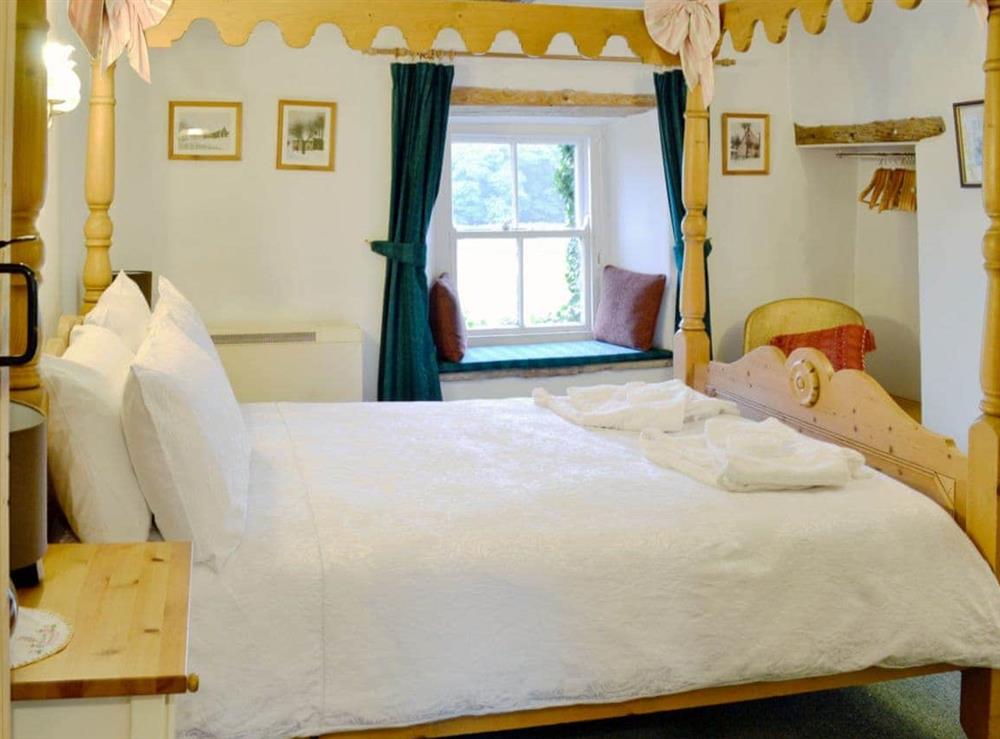 Four Poster bedroom at Redmayne Cottage in Orton, Cumbria., Great Britain