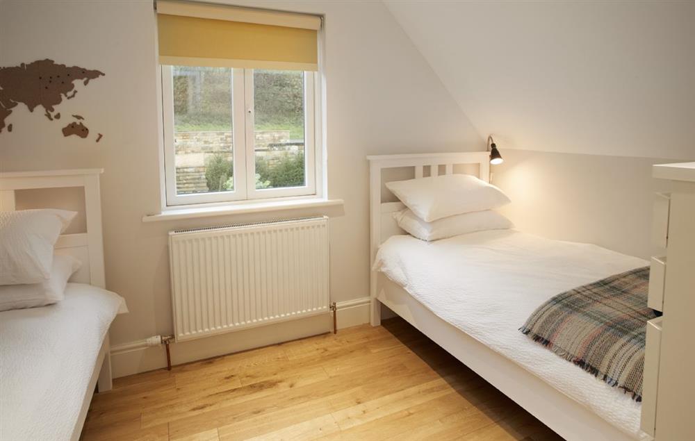 Bedroom Four has two single beds at RedRoofs, Aislaby