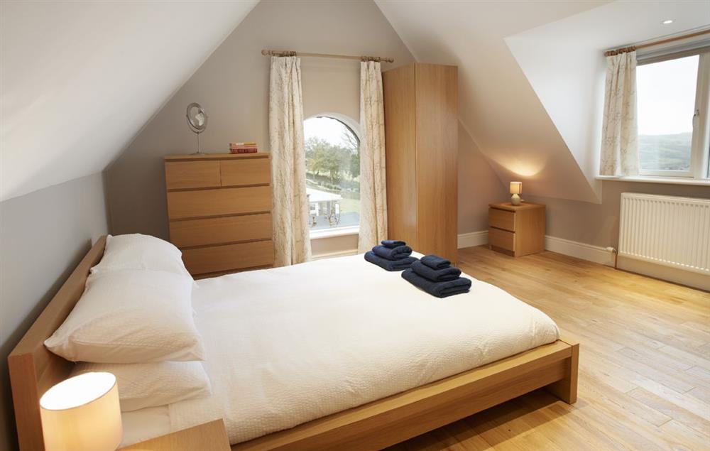 Bedroom Three has a double bed and en-suite shower room at RedRoofs, Aislaby