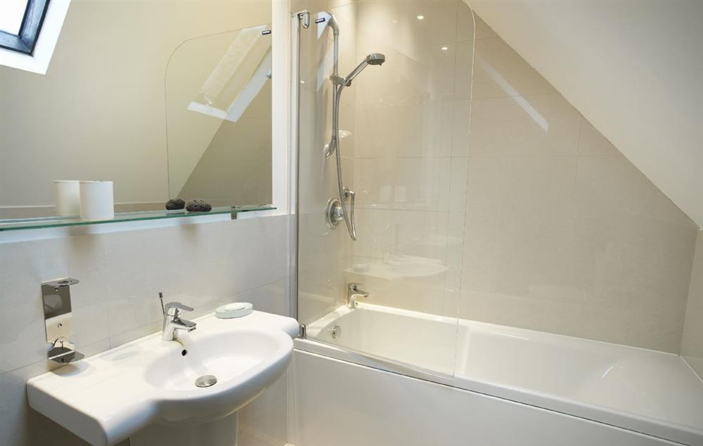 Family bathroom with bath and shower over at RedRoofs, Aislaby