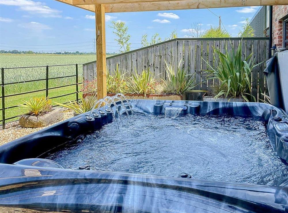 Relaxing hot tub with a wonderful view at Walnut Barn, 