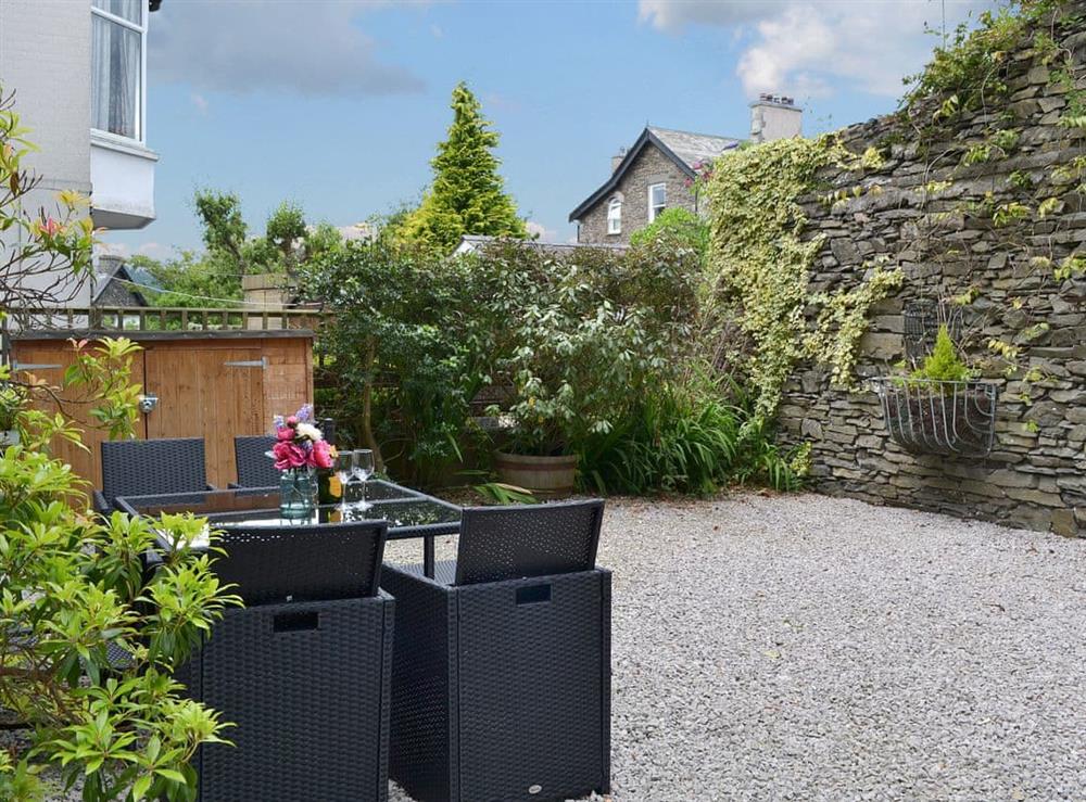 Lovely sitting out area in gravelled courtyard garden at Redruth in Bowness-on-Windermere, Cumbria