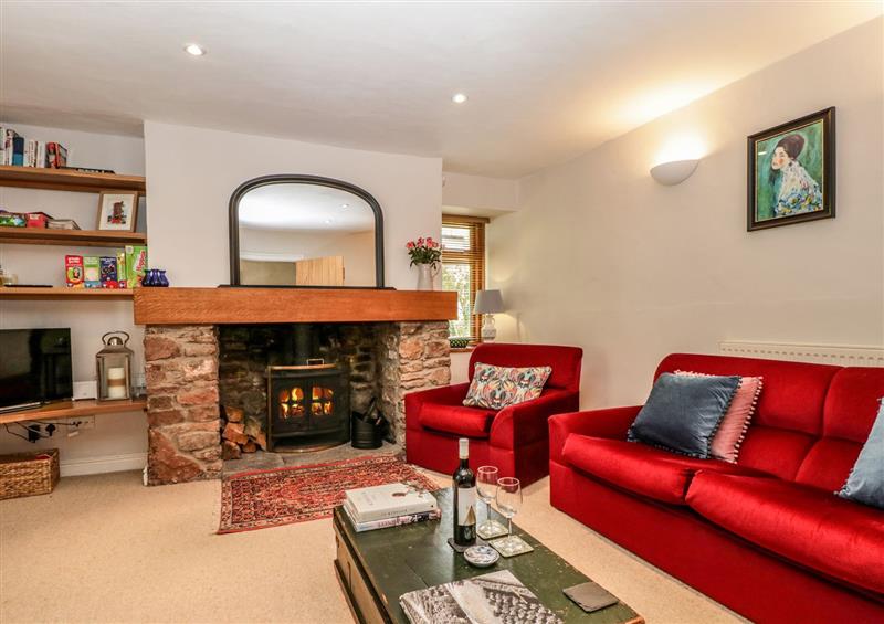 Relax in the living area at Redwood Cottage, Blagdon