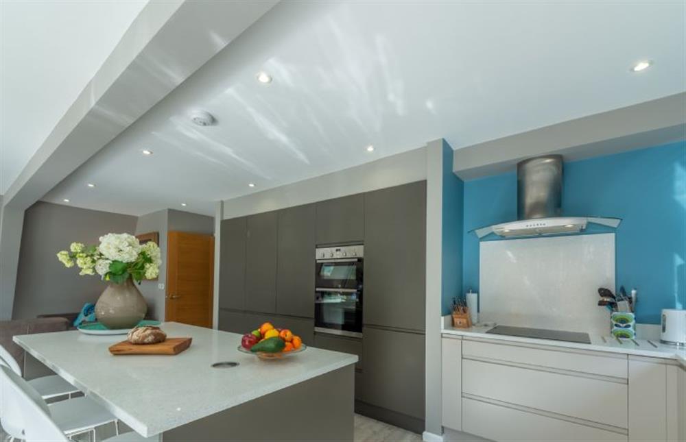 Ground floor: Kitchen island with seating at Reedcutter Lodge, Weybourne near Holt