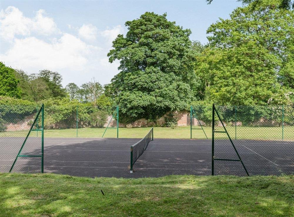Tennis court at Reedham Old Hall in Reedham, Norfolk