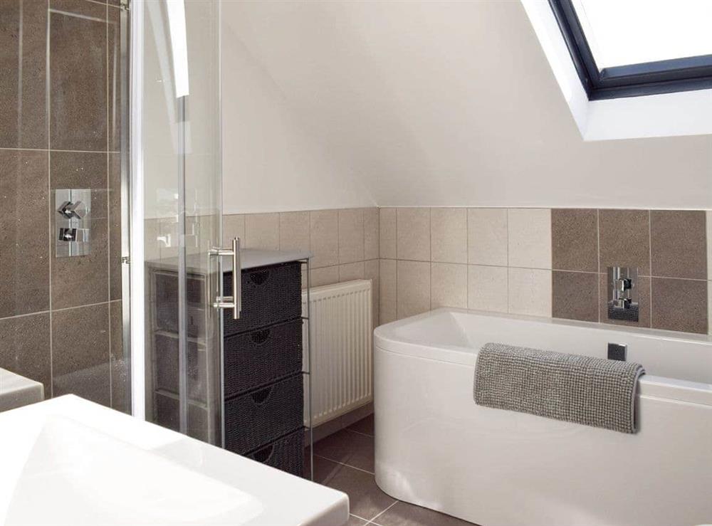 Bathroom with bath and separate shower enclosure at Reflections in St Monans, near Anstruther, Fife