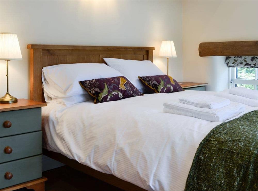 Welcoming bedroom with sumptuous double bed at Reivers Retreat in Denton Mill, near Brampton, Cumbria