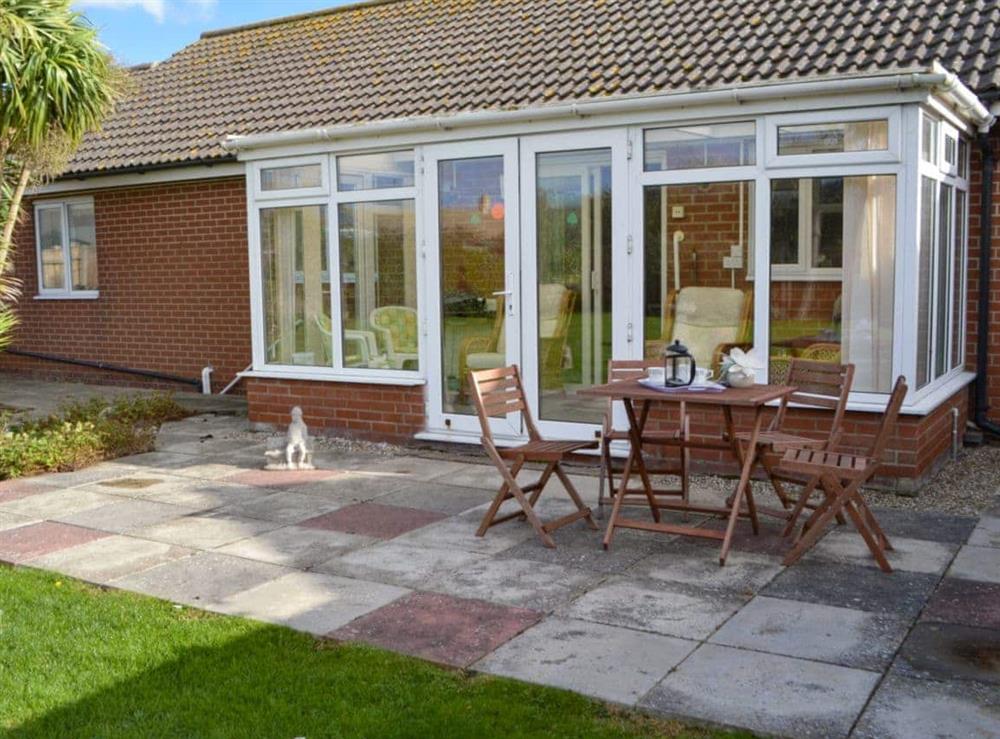 Large patio area at Rest-A-While in Walcott, near North Walsham, Norfolk