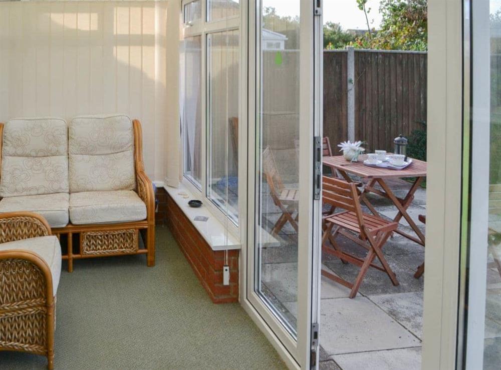 Light and airy conservatory at Rest-A-While in Walcott, near North Walsham, Norfolk