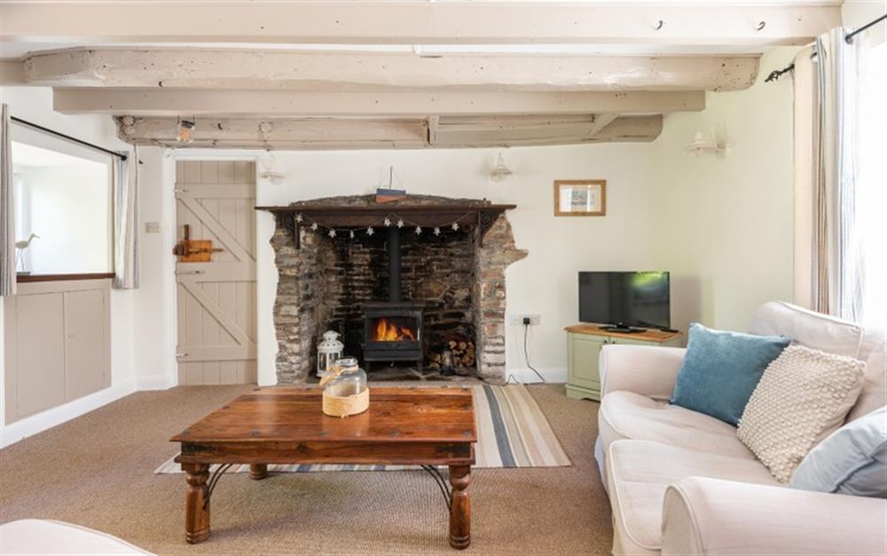 Cosy up around the log burner on a cool winters evening at Rest Cottage in Stokenham