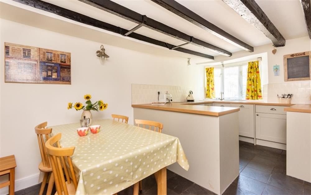 Cottage kitchen diner, cosy and welcoming at Rest Cottage in Stokenham