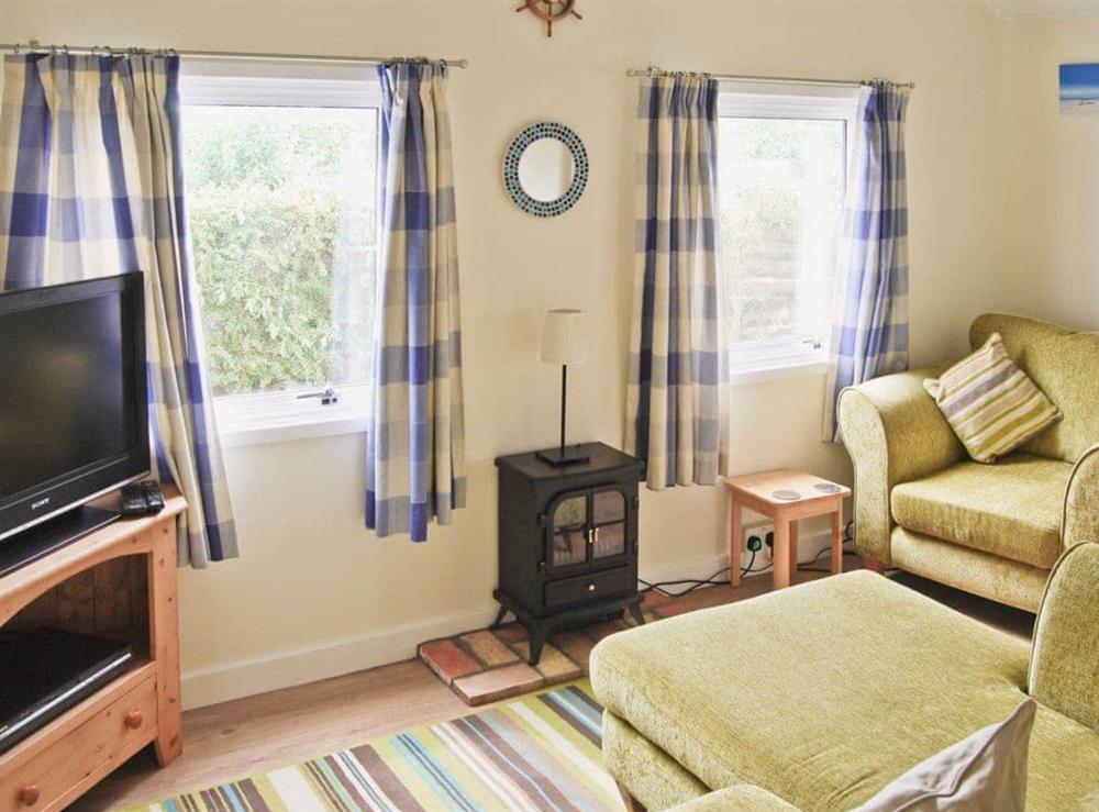 Living room at Rest-Haven in Bacton, near Wroxham, Norfolk
