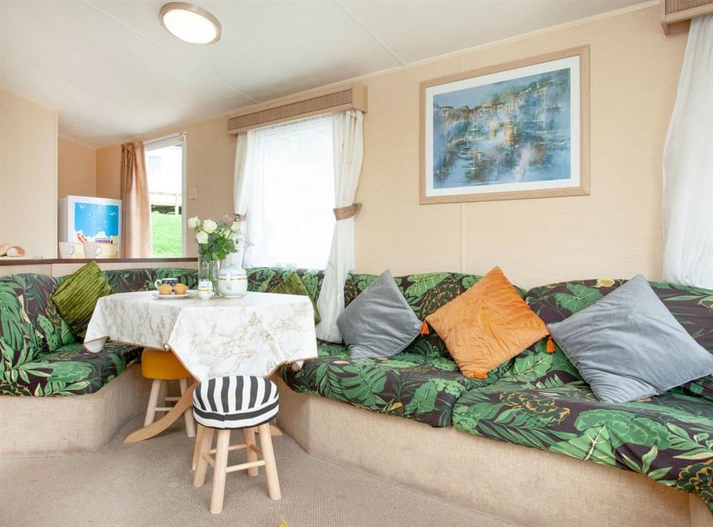 Open plan living space at Retro Lodge in Paignton, Devon