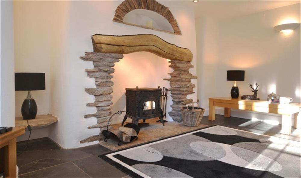 The fireplace with woodburner at Revelstoke Park House in Noss Mayo