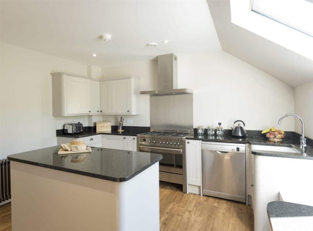 Well-equipped kitchen with island at Property 1, 