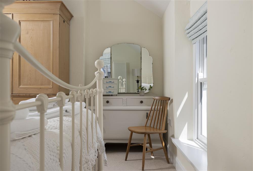 First floor: Bedroom one with dressing table at Rexton House, Llantwit Major