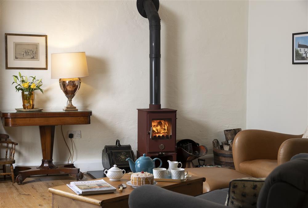 Ground floor: Sitting room with wood burning stove and relaxed seating at Rexton House, Llantwit Major