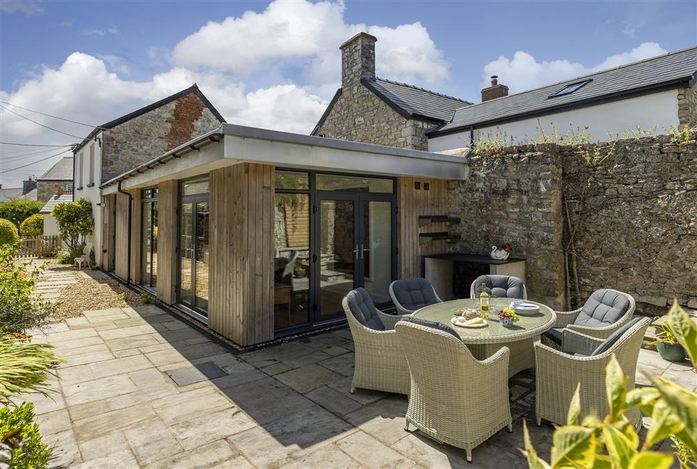 Outside is a beautiful, fully enclosed courtyard garden with outdoor food preparation area at Rexton House, Llantwit Major