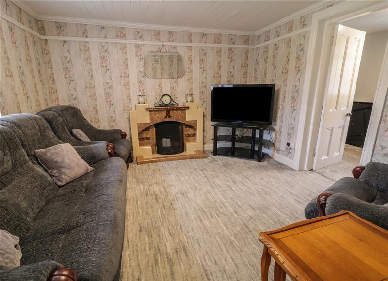 Relax in the living area at RGs Cottage, Downings