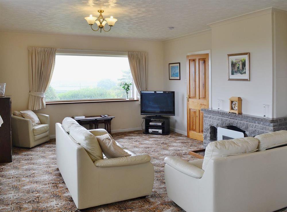Stylish living room with contemporary living flame fire at Rhandir-Mwyn in Caernarfon, Gwynedd