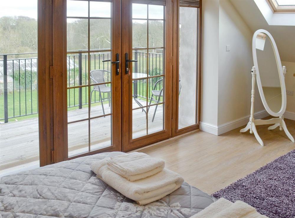 French doors from double room to balcony at Rhiwal Kitty in Bodedern near Holyhead, Gwynedd
