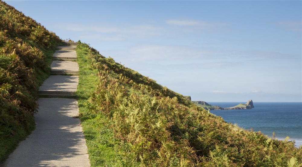 Coastal pathway climbing the cliffs at Rhossili Old Rectory in Rhossili, South Wales