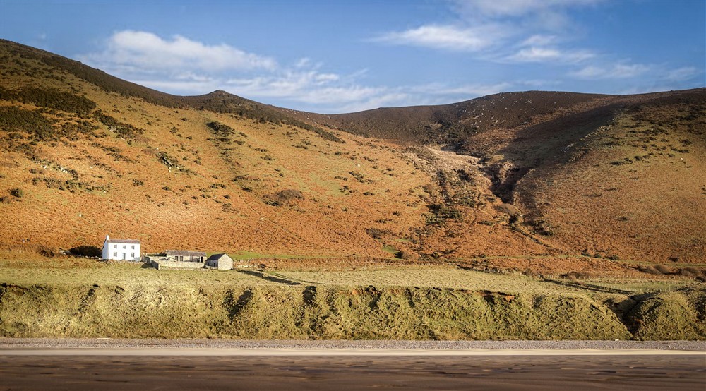 Rhossili Old Rectory, viewed from the beach, South Wales at Rhossili Old Rectory in Rhossili, South Wales