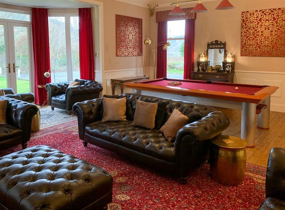 Spacious living room with billiard table at Rhumhor House in Carrick Castle, near Lochgoilhead, Argyll