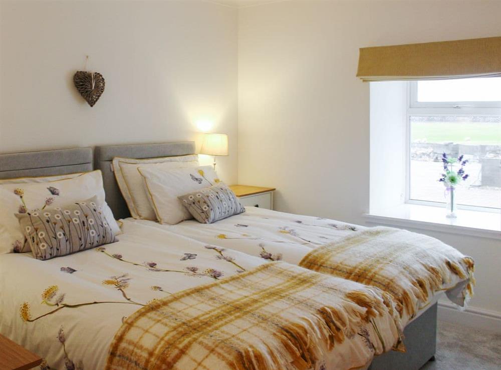 Comfortable twin bedroom at Rhunahaorine Cottage in Tayinloan, near Tarbert, Argyll