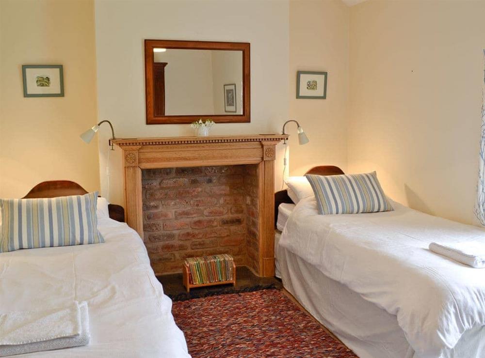 Twin bedroom with feature fireplace at Rhydlanfair in Nr Betws-y-Coed, Gwynedd., Great Britain