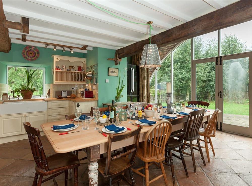 Kitchen and dining area with French doors to garden at Rhydloes Mill in Llansilin, near Oswestry, Powys