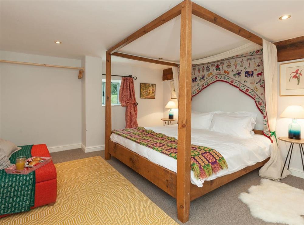 Relaxing en-suite four poster bedroom at Rhydloes Mill in Llansilin, near Oswestry, Powys