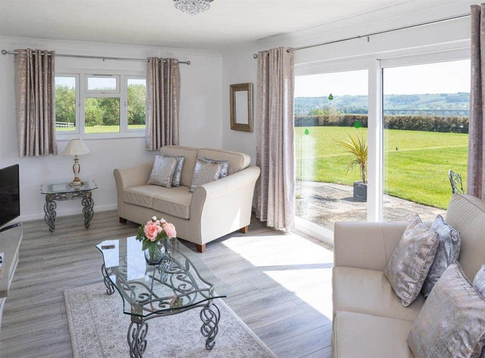 Spacious living room with sliding door to garden at Riffa Manor Bungalow in Leathley, near Harrogate, West Yorkshire