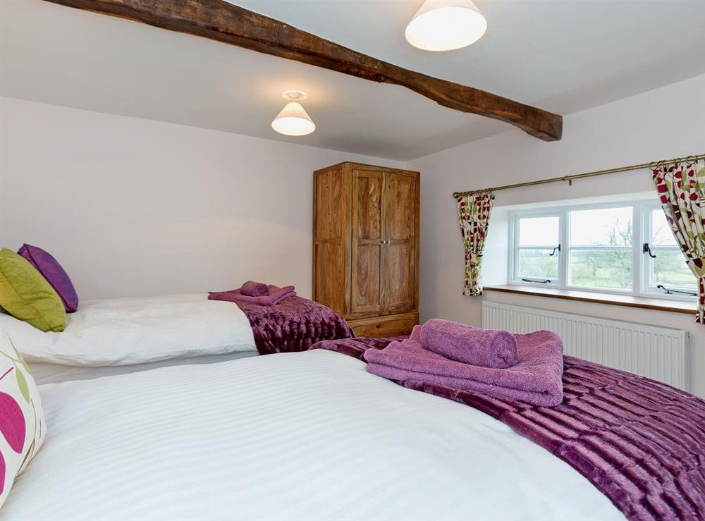 Cosy twin bedroom at Rimmers Farmhouse in Wichenford, near Worcester, Worcestershire