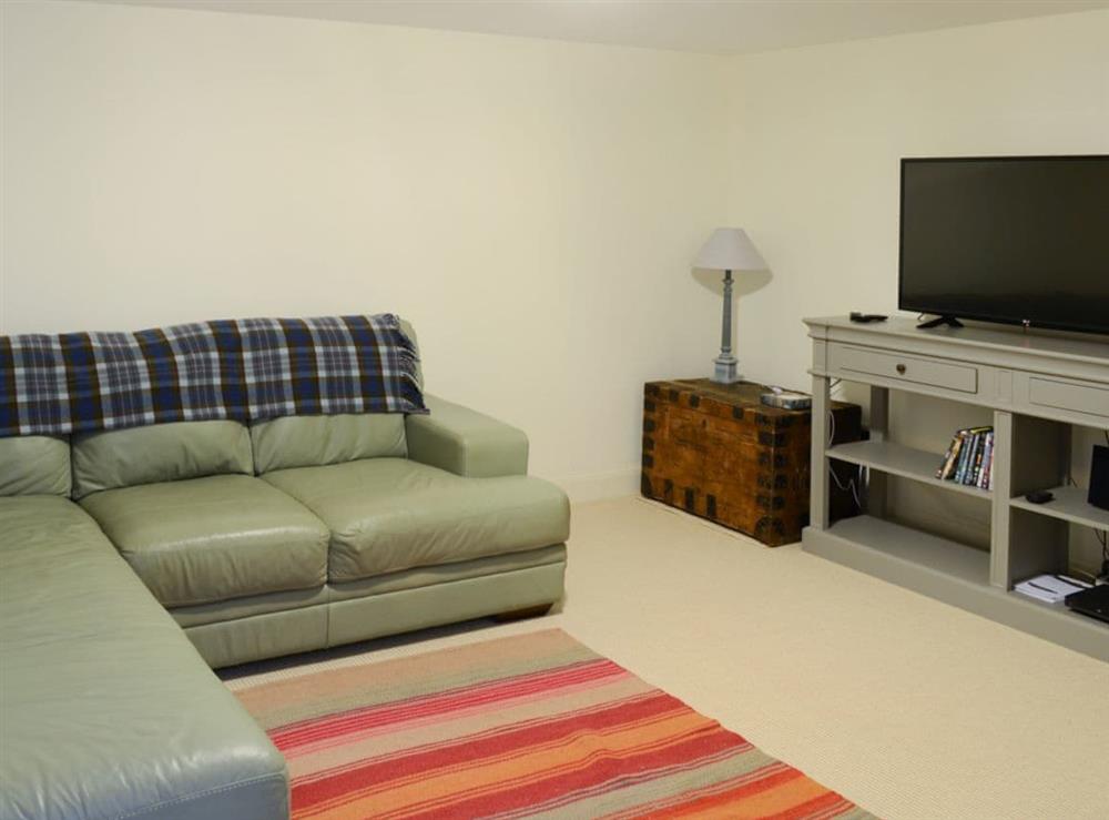 Ground floor living room with comfortable sofas at The Fish House, 