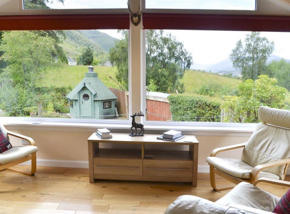 Welcoming sun room overlooking the stunning views at River Mill House in Ballachulish, near Fort William, Argyll