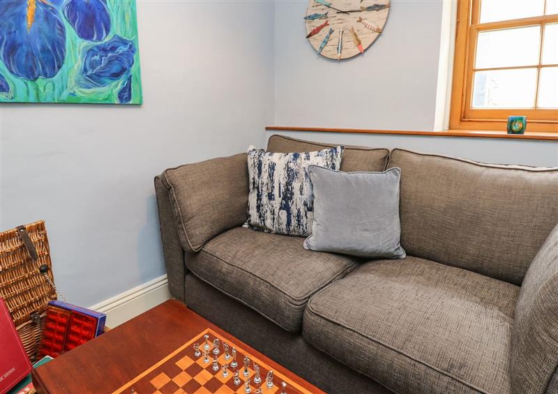 Relax in the living area at Riverdance Cottage, Lyme Regis