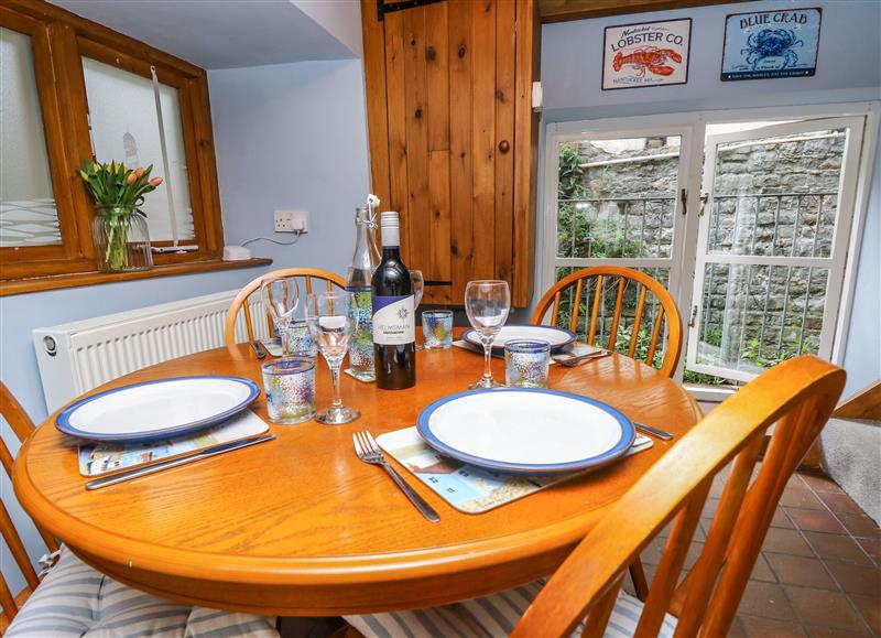 The dining area at Riverdance Cottage, Lyme Regis
