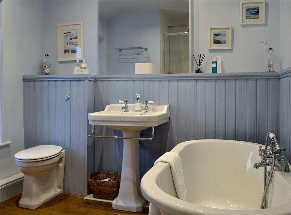 Family bathroom with bath and separate shower cubicle at Riverholme in Bassenthwaite, near Keswick, Cumbria
