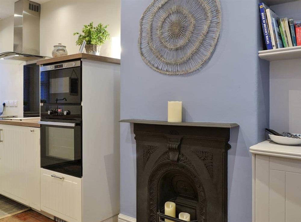 Feature fireplace within kitchen/diner at Riverholme in Bassenthwaite, near Keswick, Cumbria