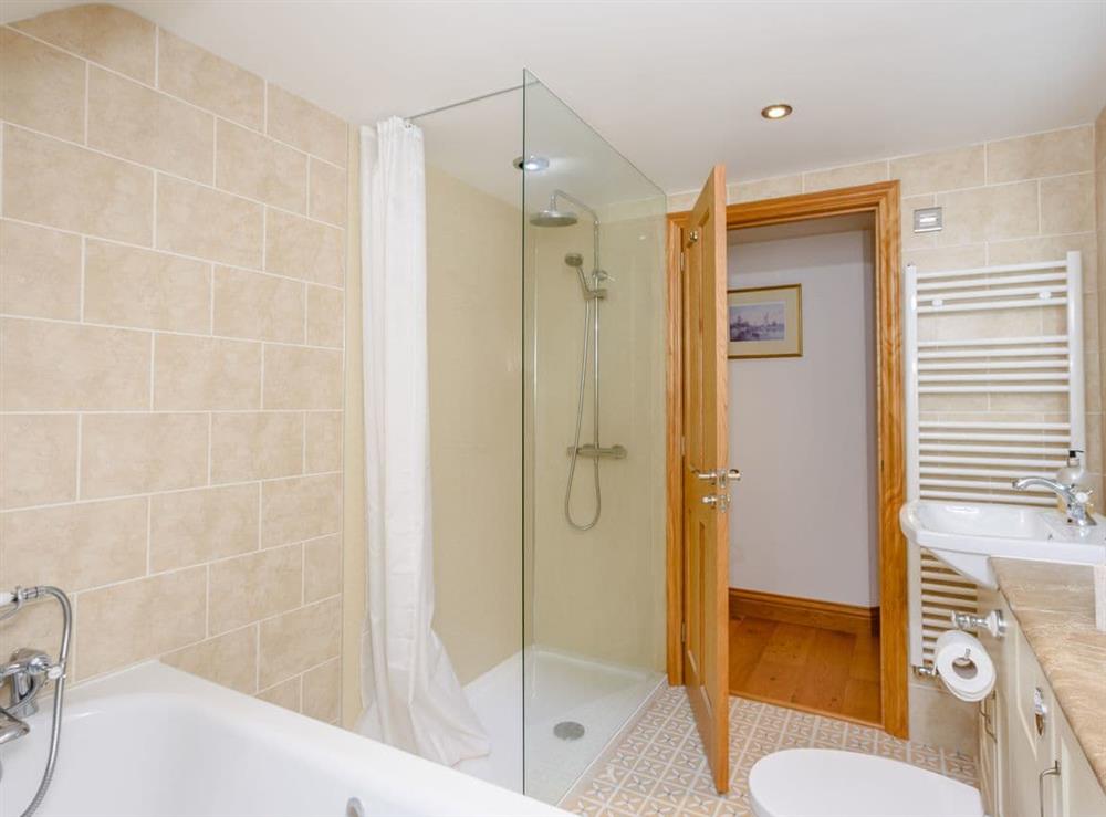 Bathroom with separate shower at Riversdale Cottage in Irstead, near Wroxham, Norfolk