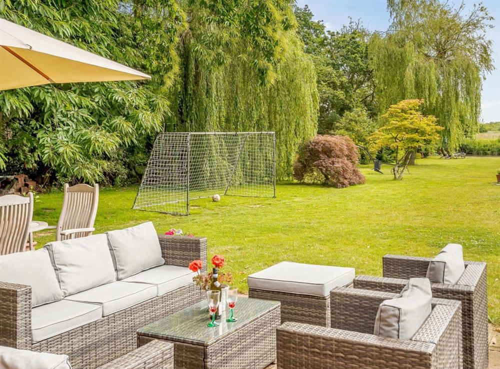 Outdoor seating area at Riversdale Cottage in Irstead, near Wroxham, Norfolk