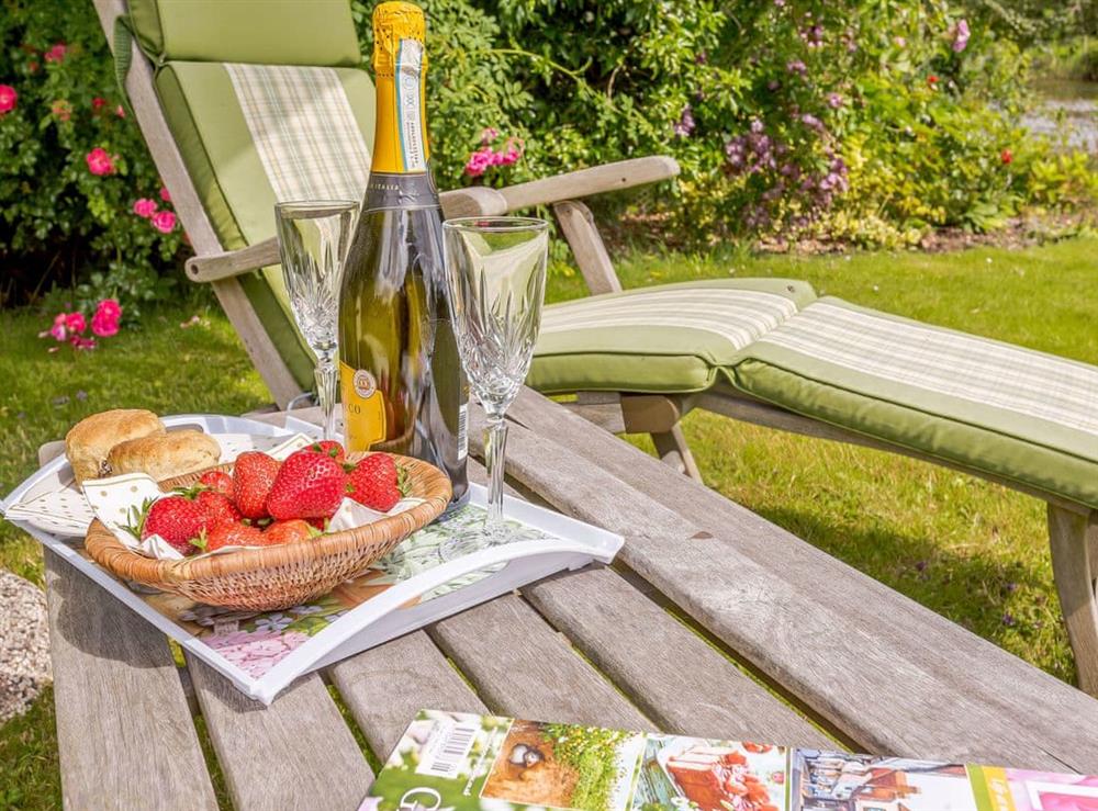 Relax in the garden at Riversdale Cottage in Irstead, near Wroxham, Norfolk