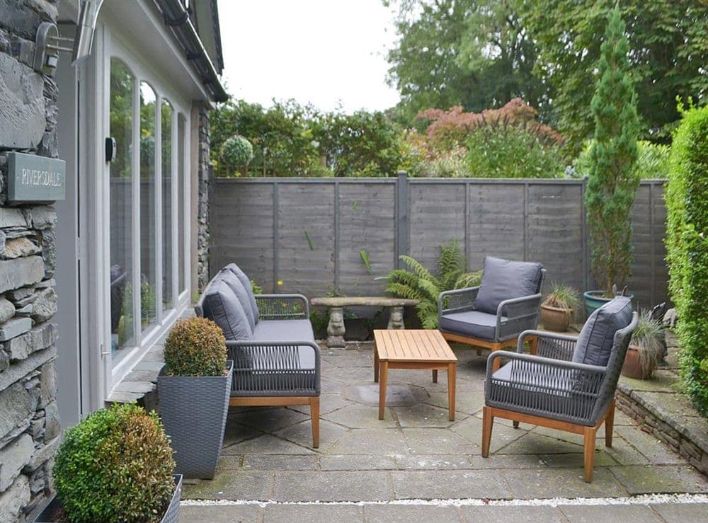 Geometrically paved patio area with furniture at Riversdale in White Bridge, near Grasmere, Cumbria